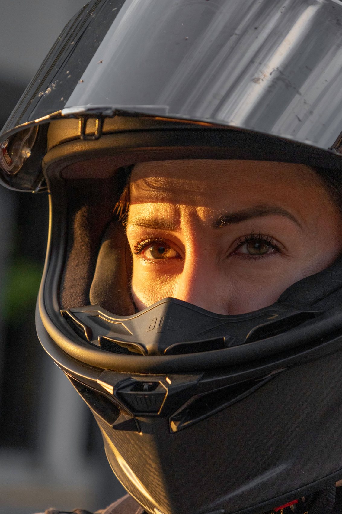 Rider in golden evening light, helmet visor up