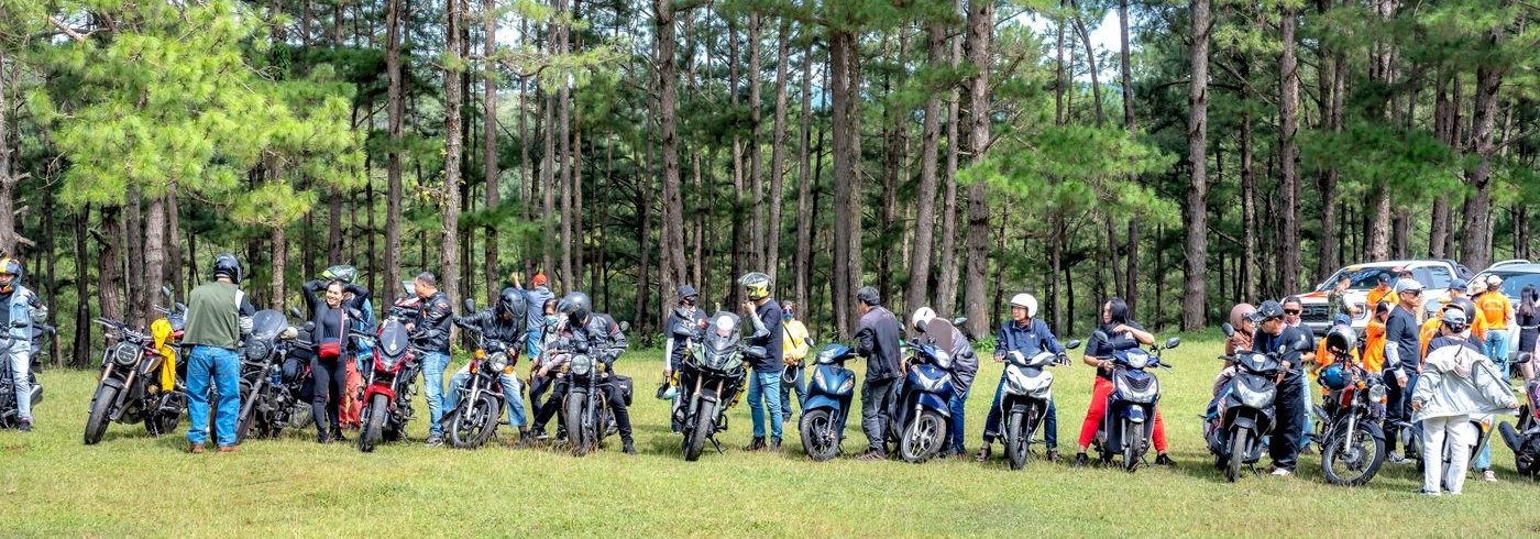 A group of riders gathered with their motorbikes