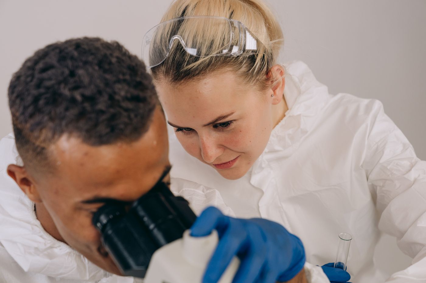 Scientists examining samples in a lab