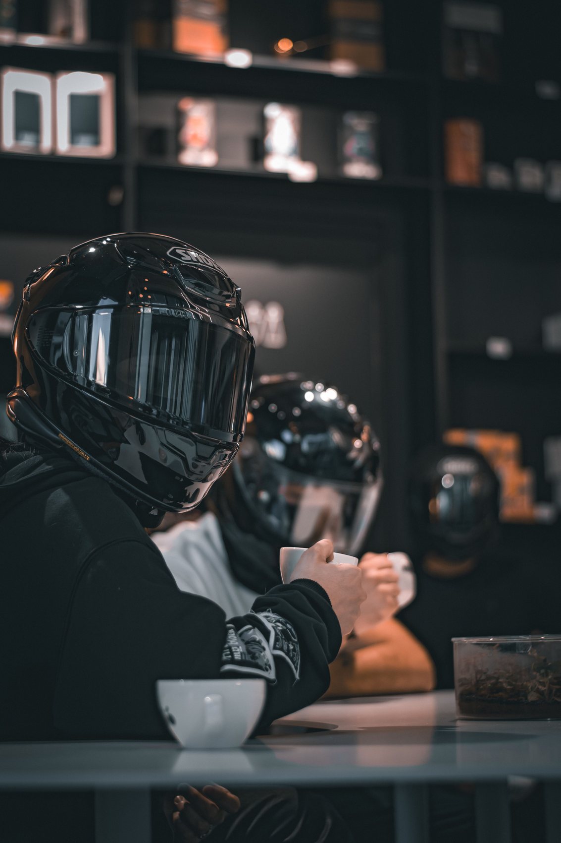 Rider with a coffee at a café